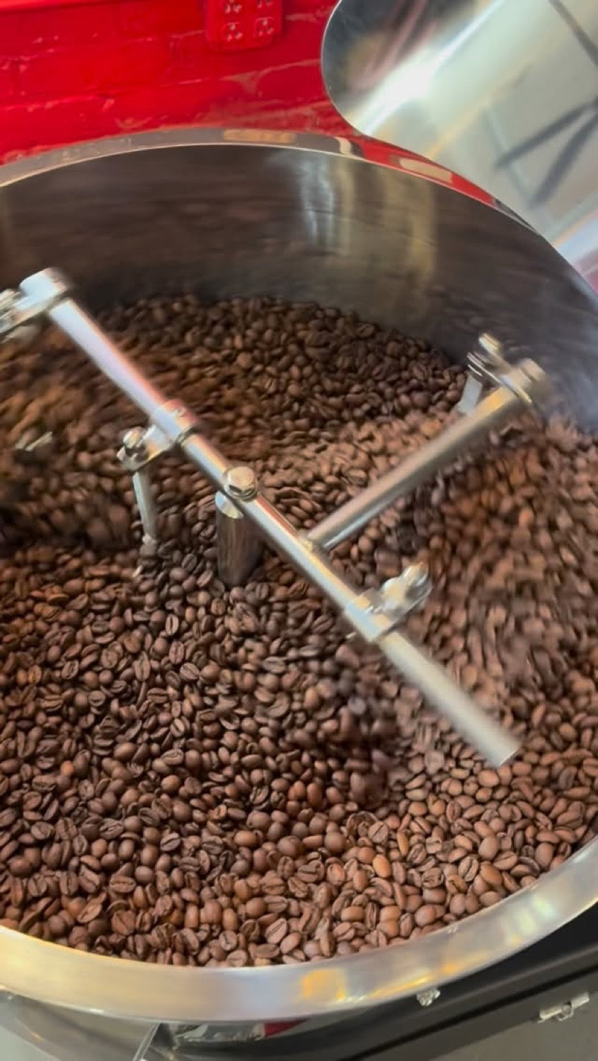 Coffee beans roasting in the drum at Love Coffee Roasters